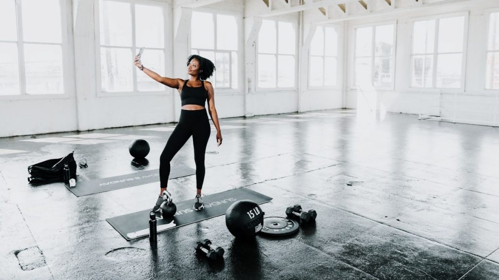 a woman is doing exercises in a gym