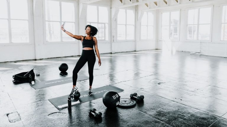 a woman is doing exercises in a gym